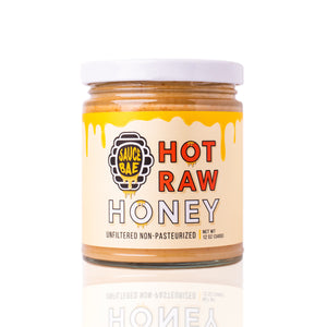 12 oz Sauce Bae Hot Raw Honey jar placed on a white backdrop, showing front side of jar.