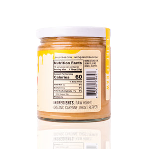 Nutrition label side of Sauce Bae Hot Raw Honey jar. The label displays the nutritional facts, indicating 60 calories per serving. The jar is set against a white background.