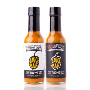 2 pack of Sauce Bae Hot Sauce Variety pack. Includes 1 bottle of Skinny Habanero, and 1 bottle of Hotter Habanero hot sauce, on a white backdrop