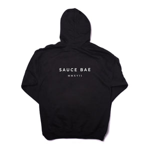 Sauce Bae Black hoodie, back view, with text logo that says Sauce Bae, followed by MMXVII Roman Numerals