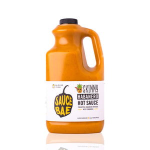 Front view of Sauce Bae's Skinny Habanero hot sauce 64 oz plastic jug.