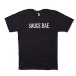 Black Sauce Bae t-shirt with off-white text on the chest, water-based print for a soft vintage feel, 100% combed ring-spun cotton.
