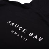 Back view of Sauce Bae black hoodie with 'Sauce Bae MMXVII' text in white. Classic design with a modern touch, representing the brand's establishment year.
