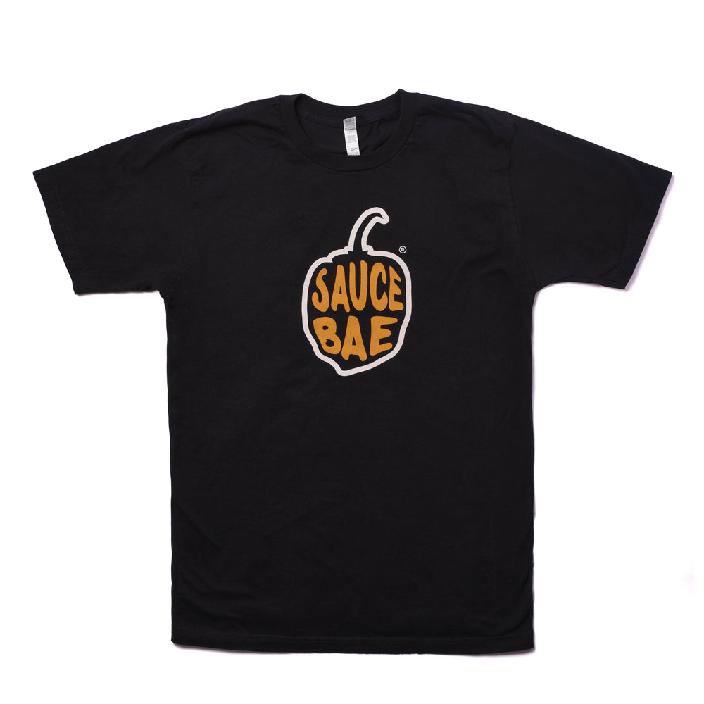 Black t-shirt with Sauce Bae pepper logo in yellow and orange on the front. The shirt is made from 100% combed ring-spun cotton, offering a casual and stylish look.