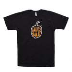 Black t-shirt with Sauce Bae pepper logo in yellow and orange on the front. The shirt is made from 100% combed ring-spun cotton, offering a casual and stylish look.