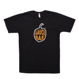 Black t-shirt with Sauce Bae pepper logo in yellow and orange on the front. The shirt is made from 100% combed ring-spun cotton, offering a casual and stylish look.